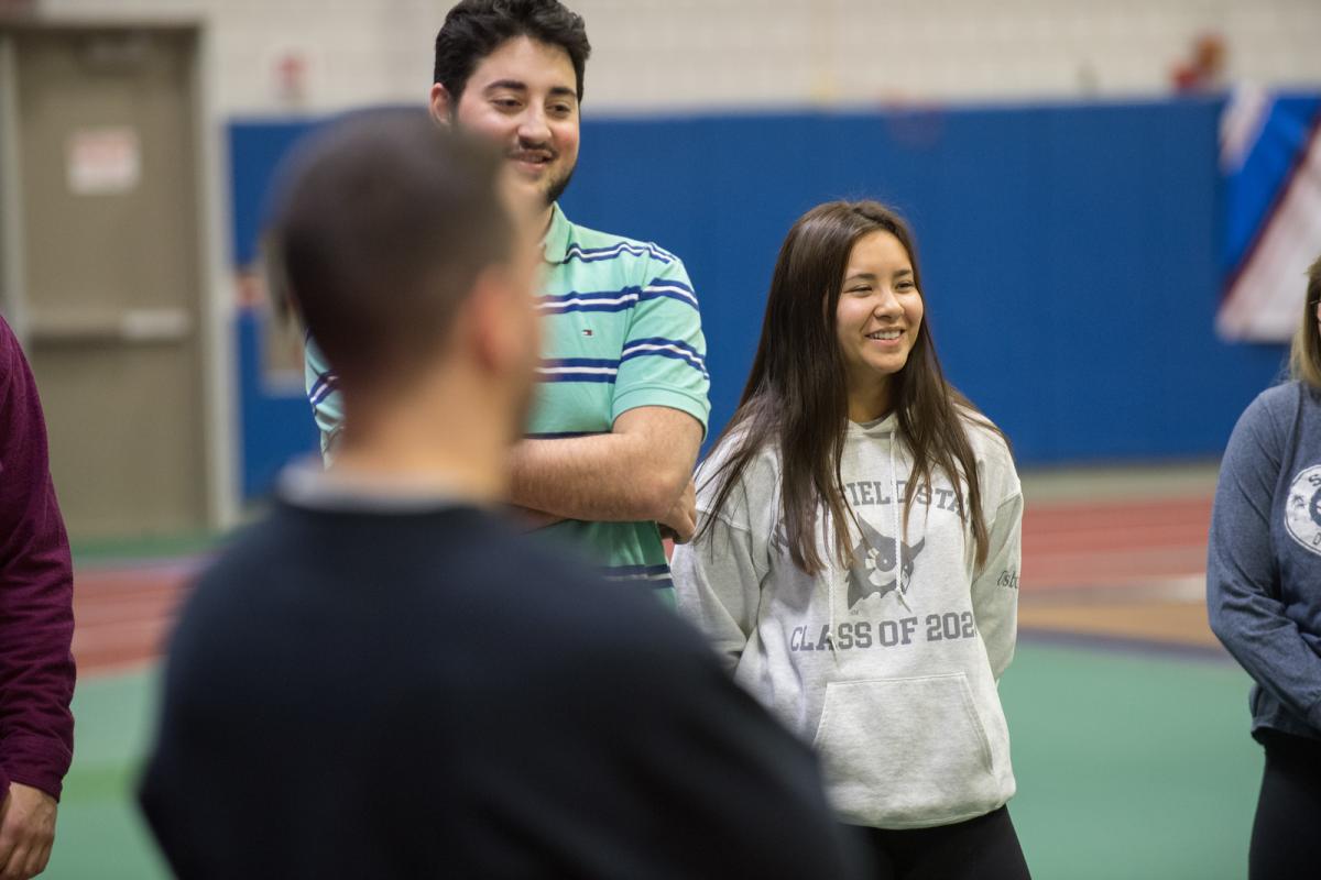 Student smiling during a Movement Science course held in the campus gym.