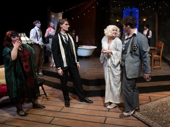 Students presenting in a production wearing costumes.