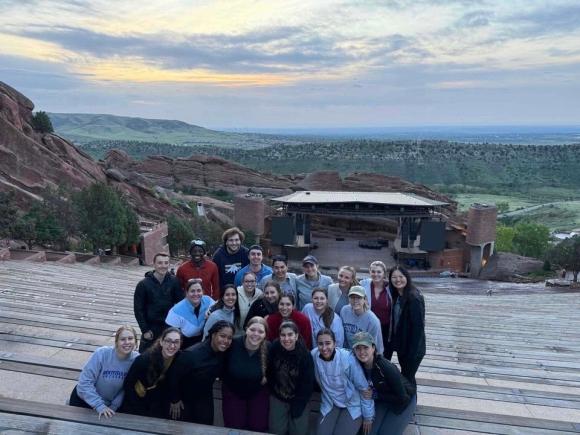 Group of students stand together at Red Rocks Amphitheatre