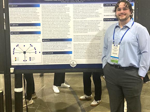 Student presenting research findings at convention.