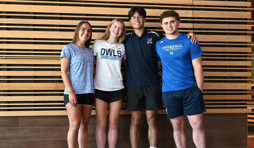 Group of students smiling together in University Hall.